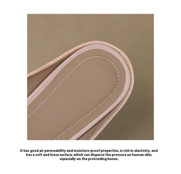 Beige leather shoe insole with subtle stitching and a soft cushioned surface of bow closed toe leather mule flats for women.