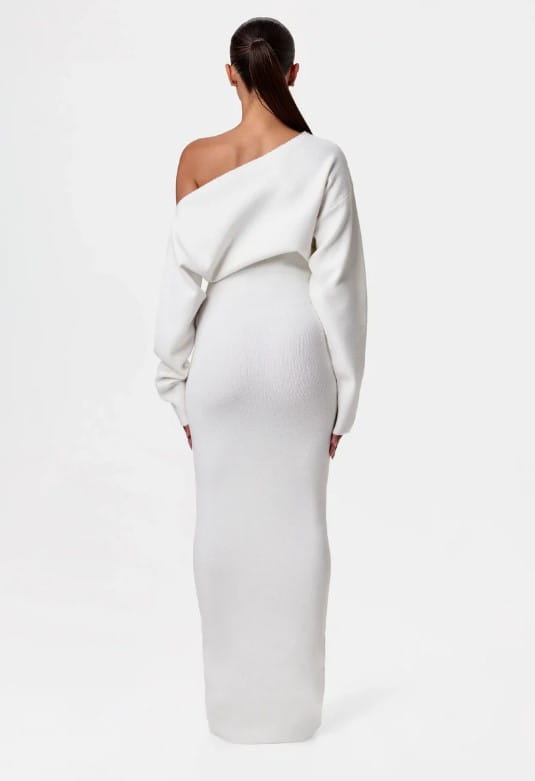 A sleek off shoulder long sleeve knitted bodycon maxi dress in white with ribbed texture.