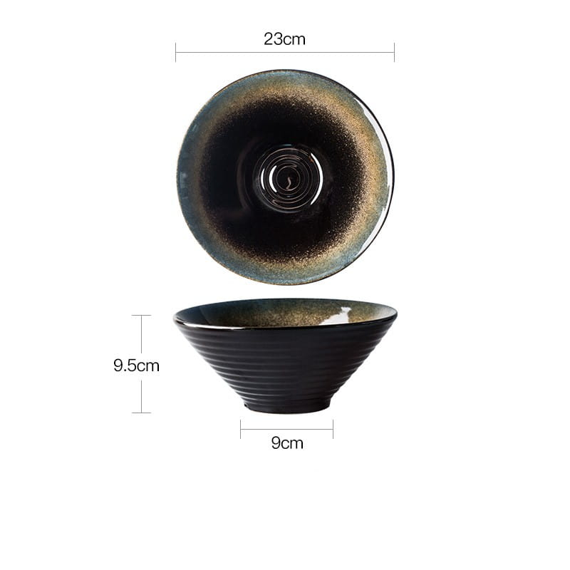 A sleek black ceramic bowl from the ceramic tableware set with a glossy kiln glaze porcelain finish transitioning to golden brown at the rim and subtle horizontal ridges along its exterior.