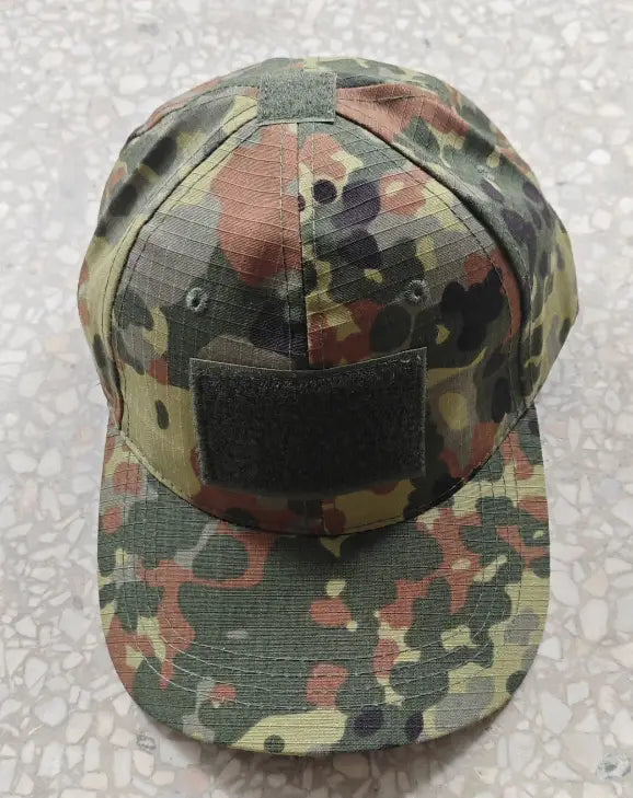 tactical camouflage mens baseball cap featuring a multi-toned green brown and black splotched pattern designed as a military sun hat.