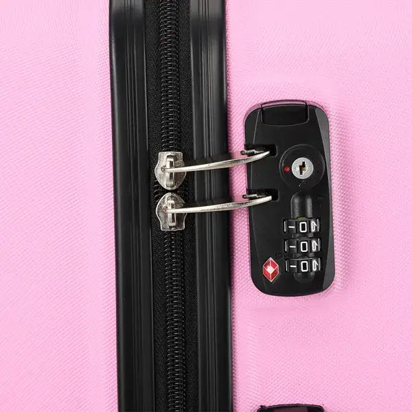 Black combination lock with silver-toned metal components and a red diamond logo on the bottom of a 3-in-1 pink hard shell large capacity suitcase set.