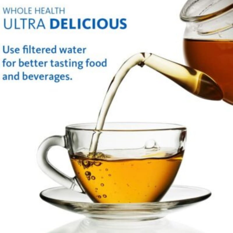 simpure 3 stage under sink water filter replacement pp uf displayed with a clear glass teacup filled with amber-colored tea resting on a matching saucer.