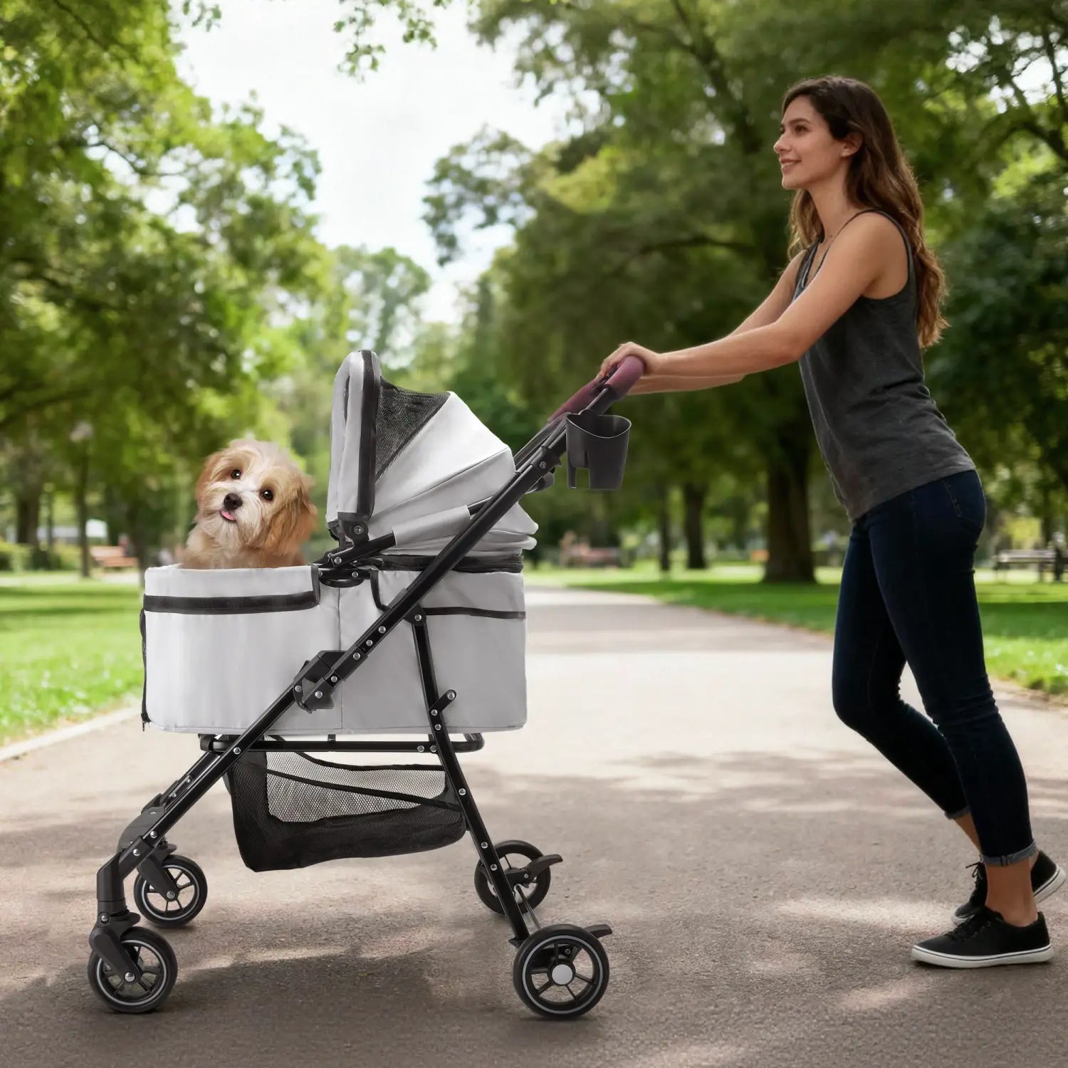 Foldable white and black pet stroller with mesh side panel carrying a small dog for small dogs and cats.