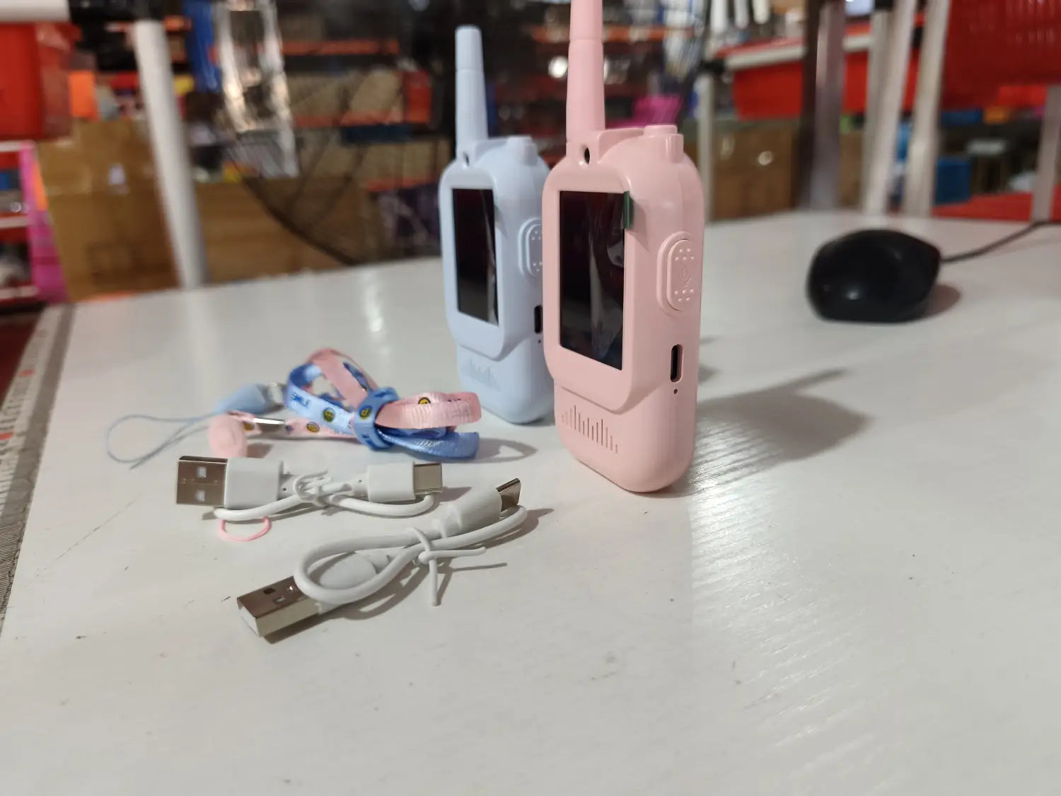 Pink plastic kids video walkie-talkie with tall antenna and small screen from rechargeable intercoms 2 pack.