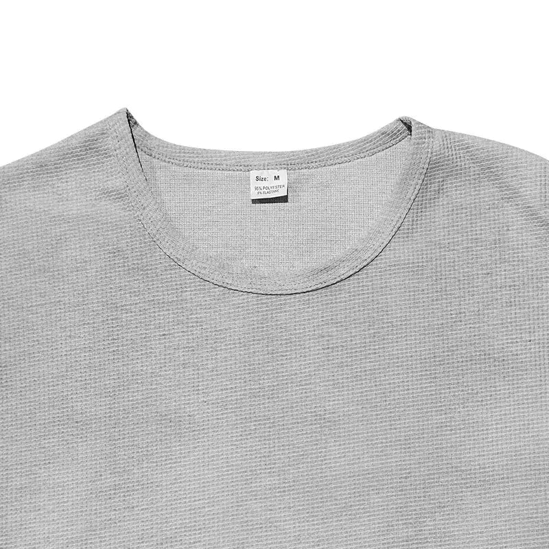 Gray textured cotton-polyester blend men’s long sleeve waffle knit thermal pullover with a crew neck.