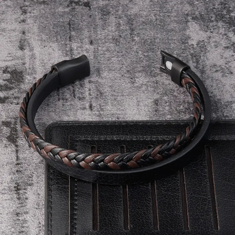 Men’s braided leather bracelet featuring black and brown leather with a sleek magnetic clasp.
