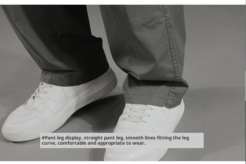 white canvas sneakers with a classic low-top design and rubber soles paired with men’s Japanese style cotton straight leg workwear pants.