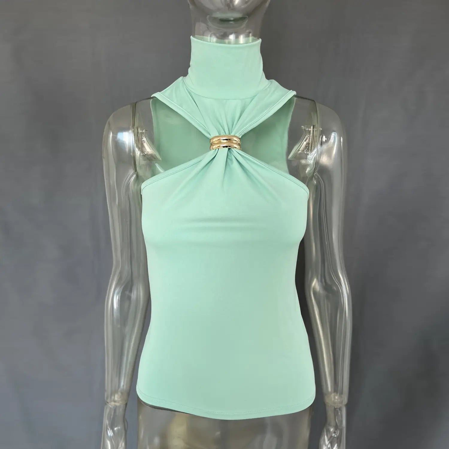 Mint green gold ring halter stretch top featuring a high-neck design with a gold-toned metal clasp at the neckline.