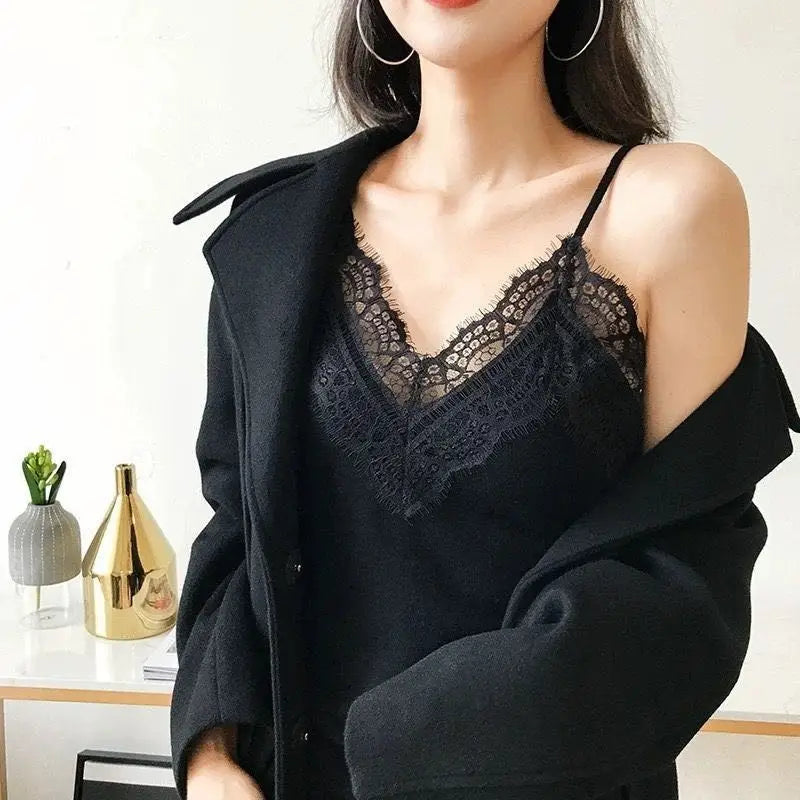 Black lace trim camisole top featuring delicate floral patterns and thin spaghetti straps.