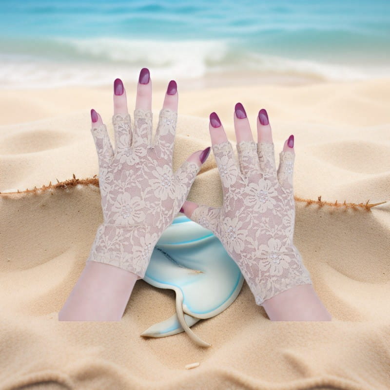 A pair of off-white floral lace fingerless gloves made of sheer mesh fabric designed for sun protection for women.