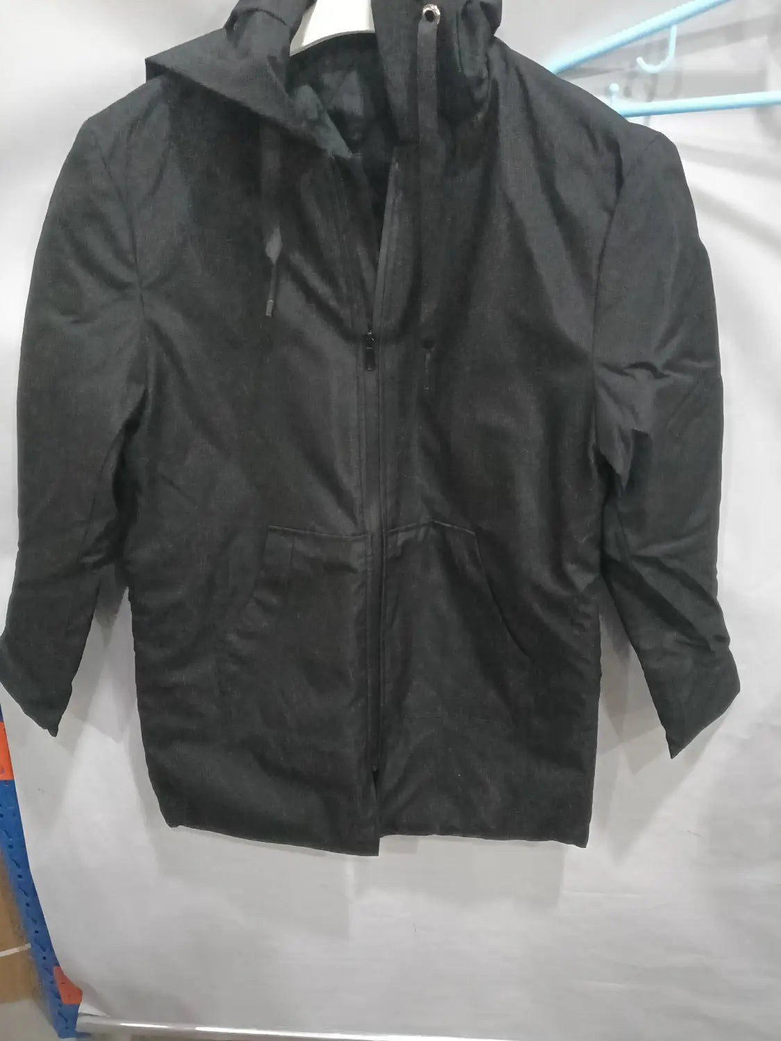 Black thick hooded winter jacket with a full-length zipper and two front pockets designed for men.