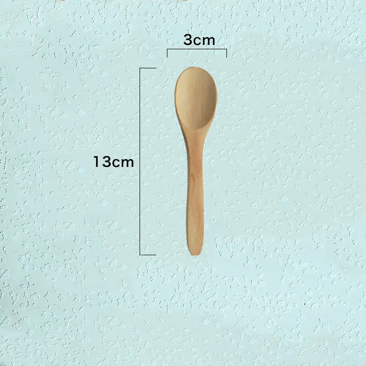 A light brown wooden spoon with a smooth natural finish measuring 13cm by 3cm from a wooden spoon set natural eco-friendly kitchen utensils.