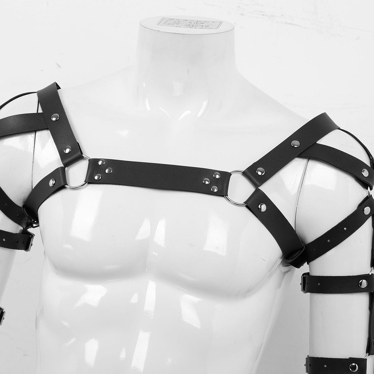 Men’s leather chest harness in black featuring silver-toned metal hardware and adjustable straps.