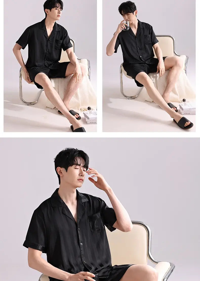 Men’s ice silk pajama set in black featuring a short-sleeved button-up shirt with a collar and subtle sheen paired with matching lightweight shorts for summer sleepwear.