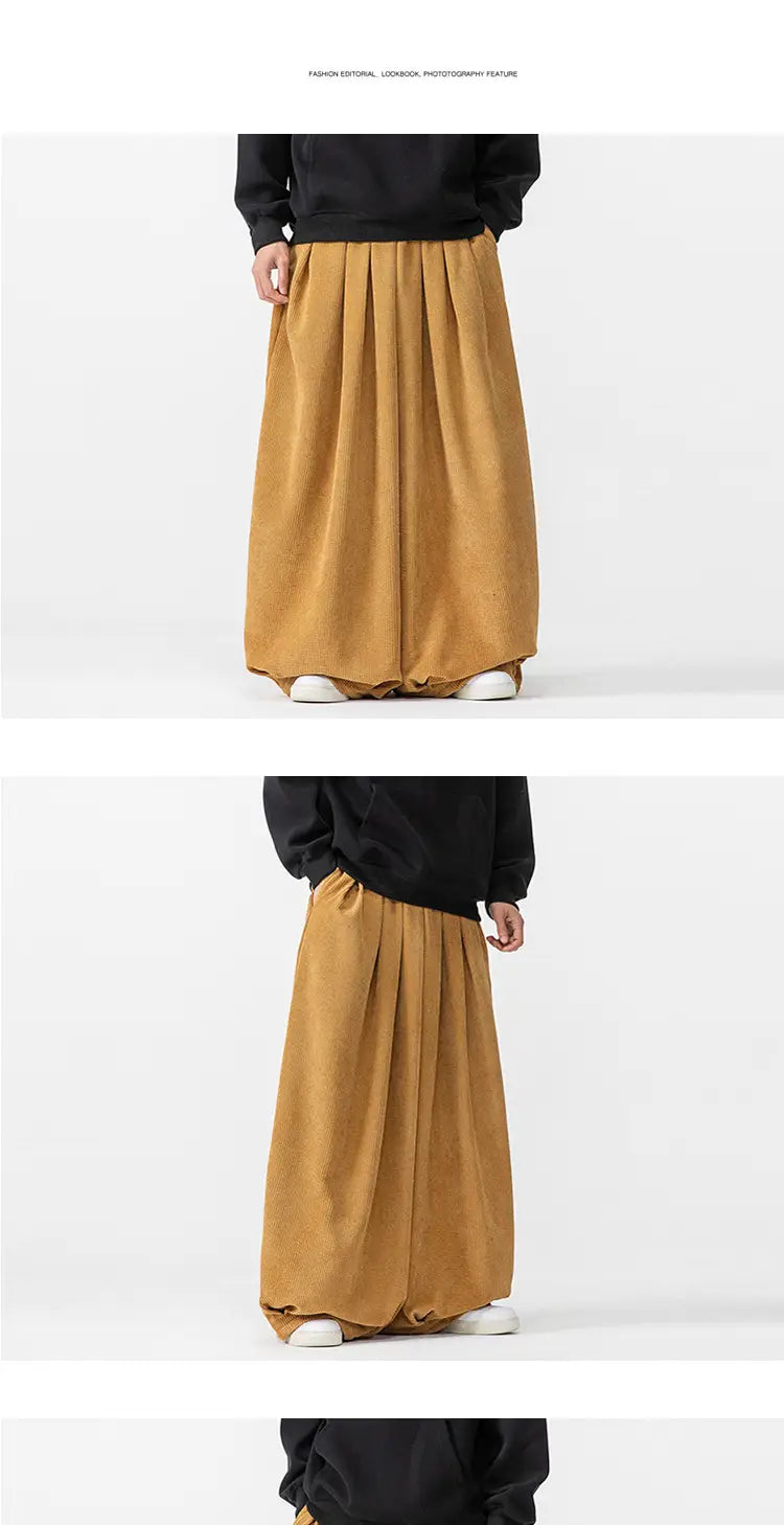 Pantalon en velours côtelé à jambes larges pour hommes, muni de jambes larges en tissu moutarde à l’écoulement fluide, doté d’une tenue souple et d’une ceinture élastique.