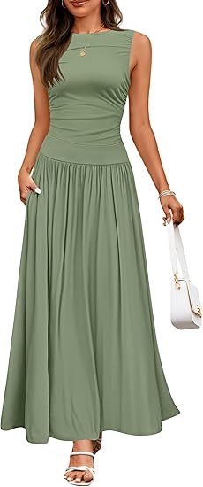 A flowing sage green sleeveless pleated maxi dress with a fitted bodice gathered waist and pockets.