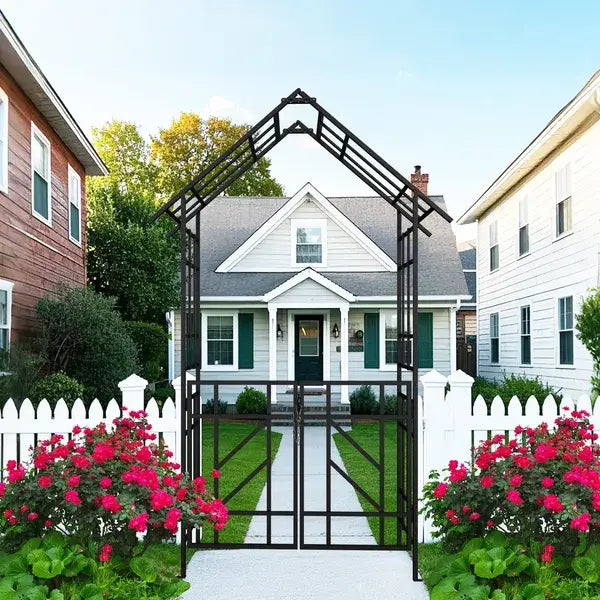 Black wrought iron arched garden gate with decorative lattice design and matching gate panels featuring bird finials in a metal garden arch for outdoor use.