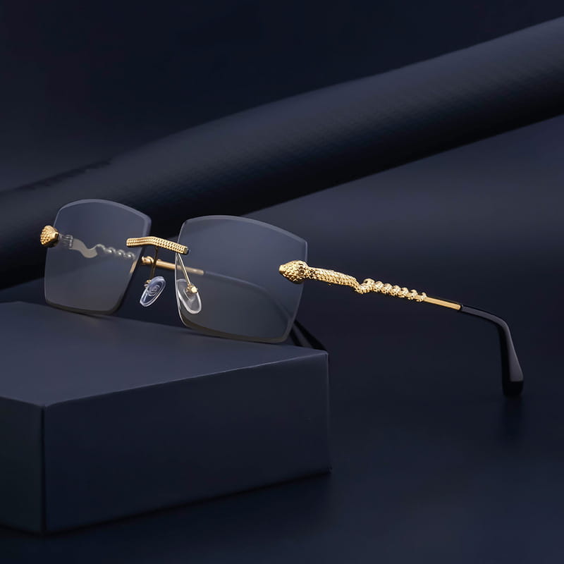 Rimless sunglasses for men featuring gold-toned snake-embossed frames with clear lenses and a sleek modern design offering UV400 protection.