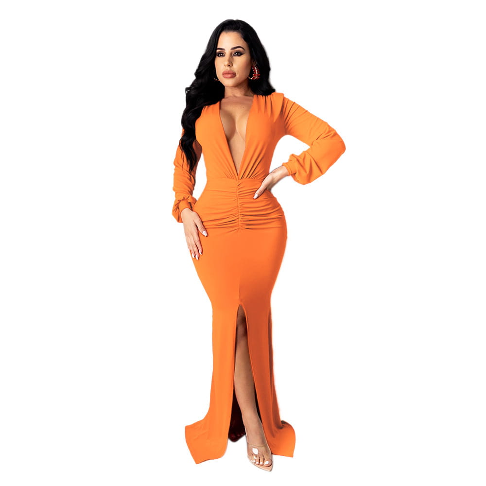 A form-fitting vibrant orange velvet v-neck evening dress with long sleeves and a side slit.