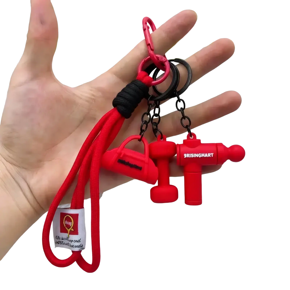 Red silicone fitness keychain with black braided cord and three gym bag themed charms including handbag dumbbell and usb drive