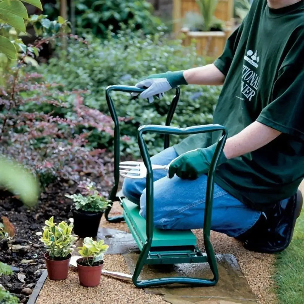 Foldable green metal garden kneeler seat with padded seat handlebars and tool pouch for gardening tasks