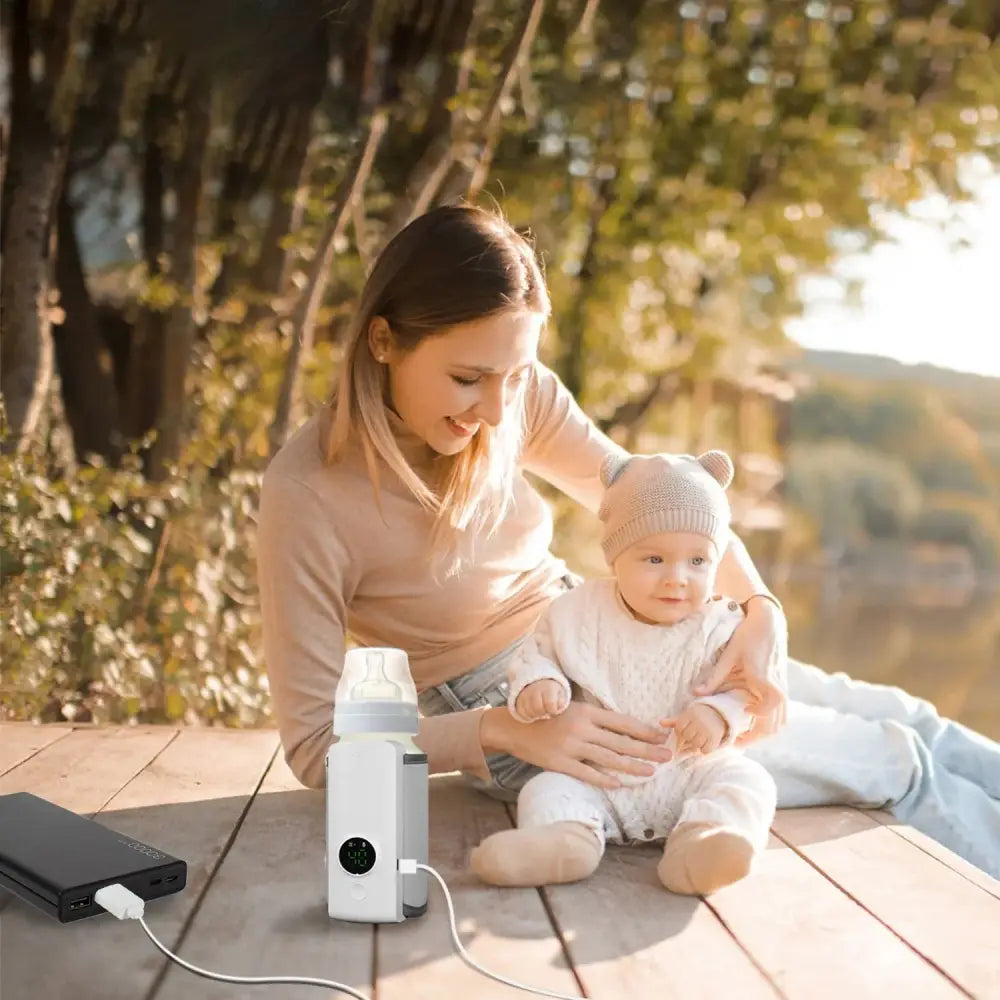 White electric portable usb baby bottle warmer with digital display and charging cable featuring 6 digital heat levels