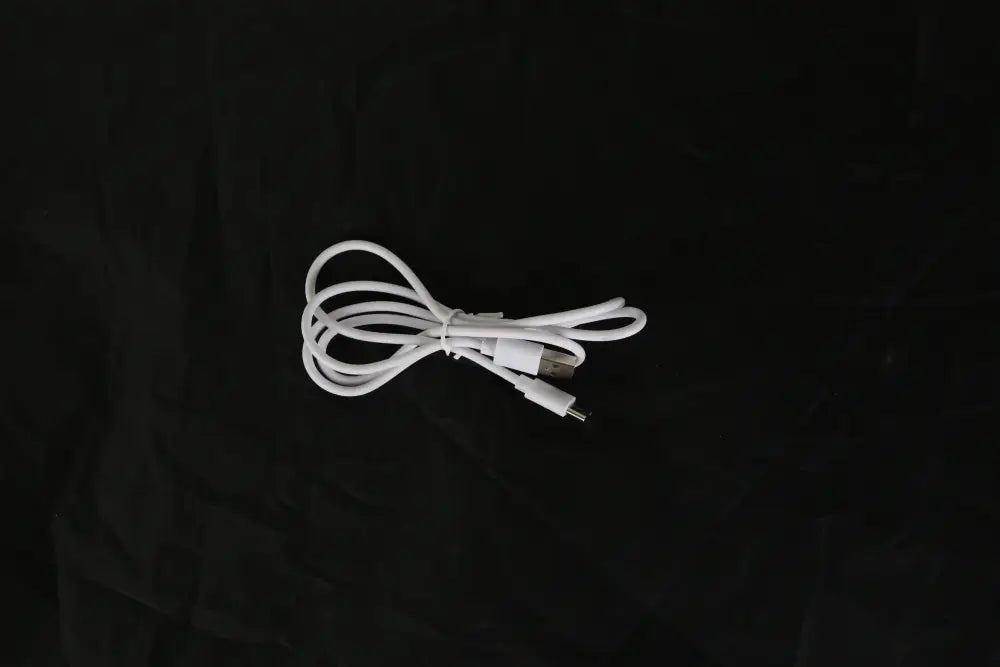 White usb-c to micro-usb charging cable for portable usb baby bottle warmer with 6 digital heat levels neatly coiled