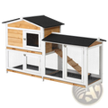 Two-level wooden rabbit hutch with white frame black roof panels and wire mesh sides featuring a ramp