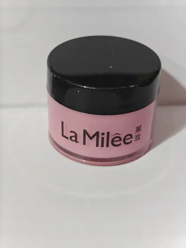 A pink la milée cosmetic jar with a glossy black lid containing cherry moisturizing night lip mask with repairing formula