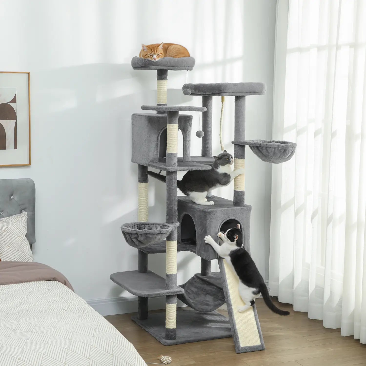 Gray multi-level cat tree tower measuring 69 inches with dark gray plush platforms and sisal scratching posts designed for cat climbing and scratching.