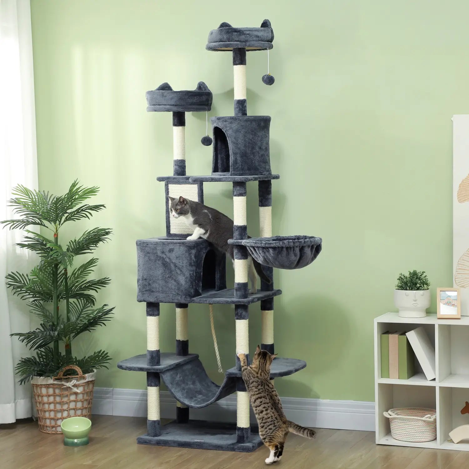 Gray plush cat tree with multiple levels platforms and scratching posts designed for tall multi level climbing and play.