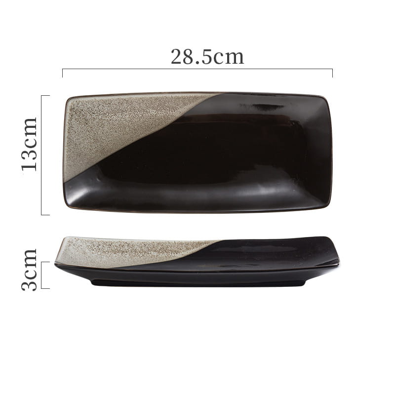 black and beige ceramic rectangular sushi plate with a speckled diagonal design for serving Japanese cuisine