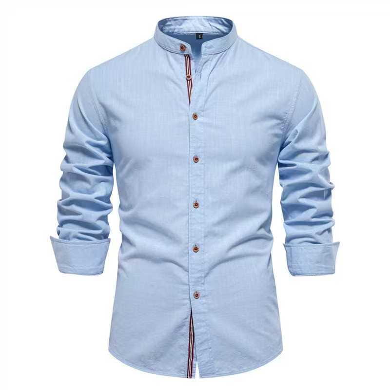 Men’s slim fit linen blend shirt in light blue with a mandarin collar and subtle striped trim along the placket featuring long sleeves.