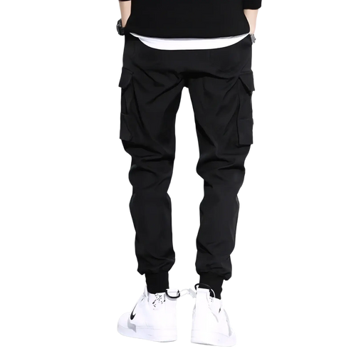 Men black tactical cargo pants with multiple side pockets and elastic cuffs for casual workwear and joggers use