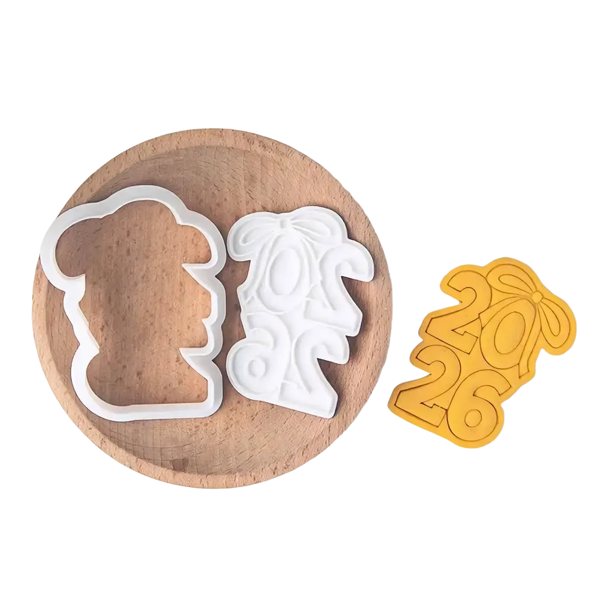 White plastic and yellow silicone 2026 graduation cookie cutter set featuring beer mug and ornate bow shapes