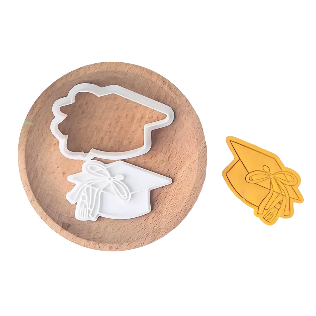 White plastic graduation cap cookie cutter with ribbon detail for 2026 graduation cookie cutter set product