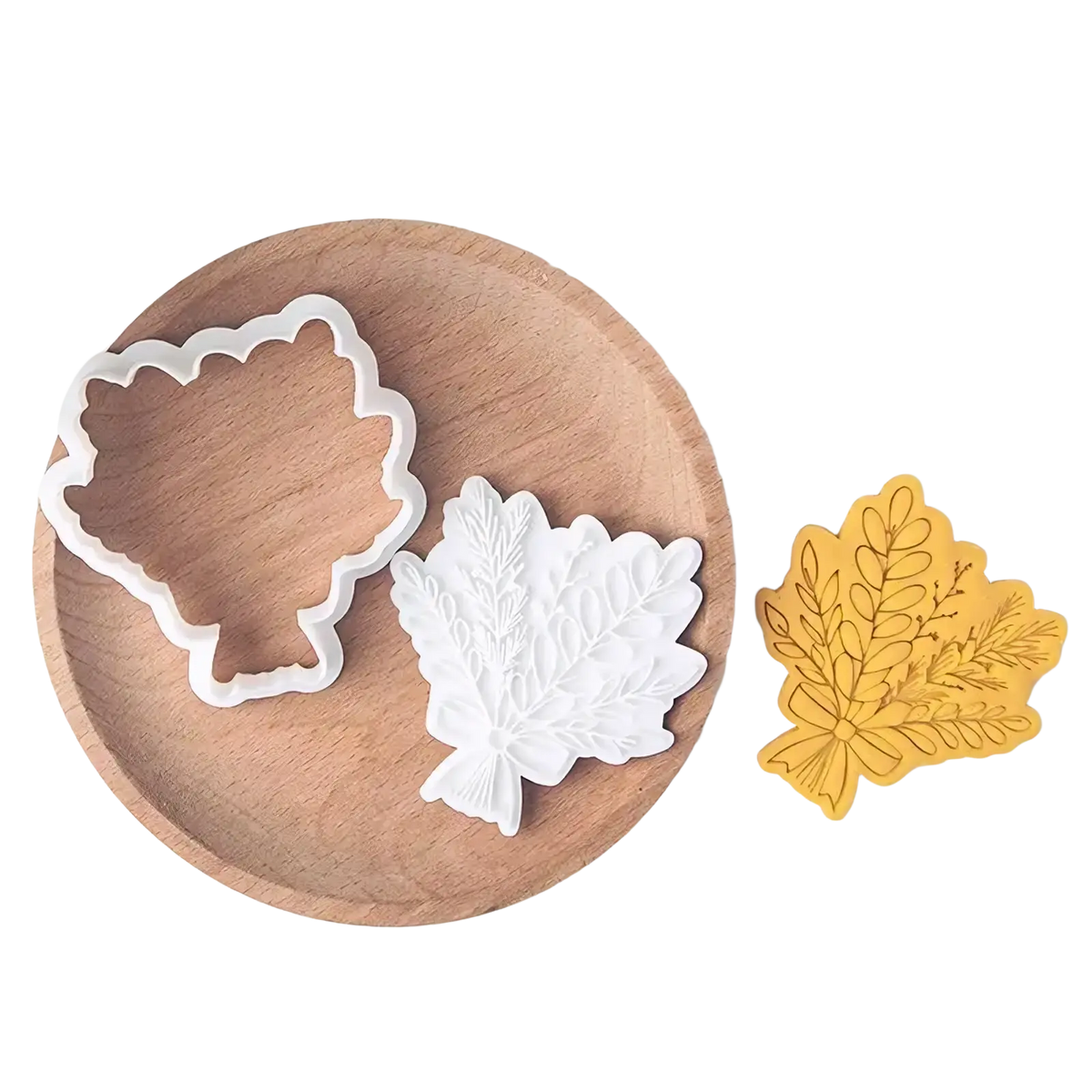 White plastic leaf shaped cookie cutters with detailed vein patterns for 2026 graduation cookie cutter set