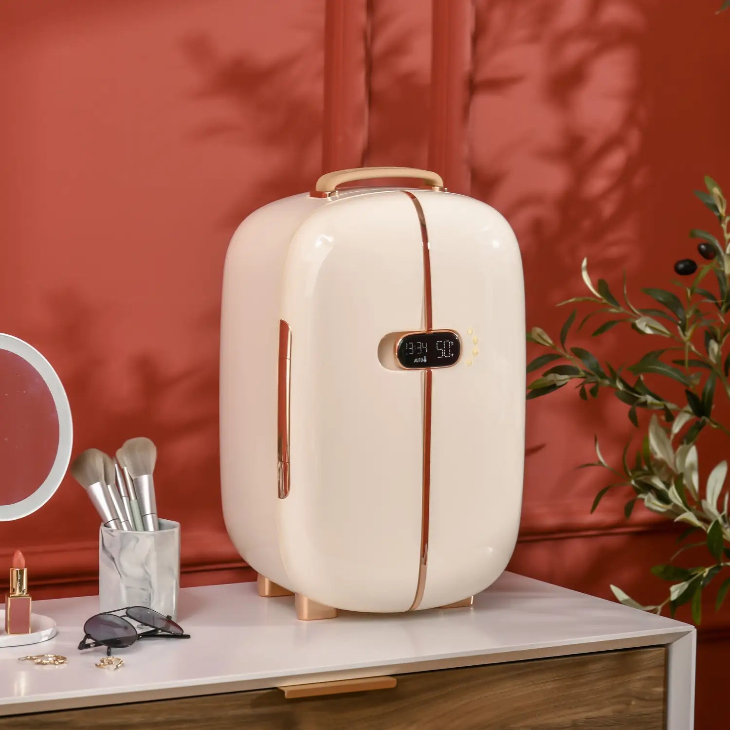 Cream-colored compact 12l portable beauty fridge with rose gold accents and digital led display designed for skincare storage.