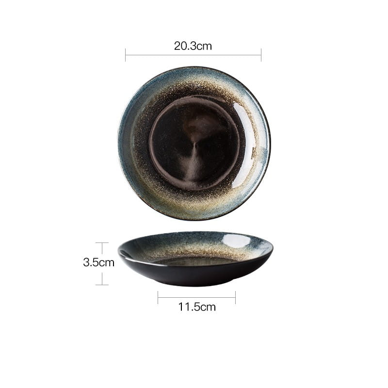 A sleek handcrafted ceramic plate from the ceramic tableware set black and gold kiln glaze porcelain features a glossy black glaze with subtle gold speckles radiating outward from the center.