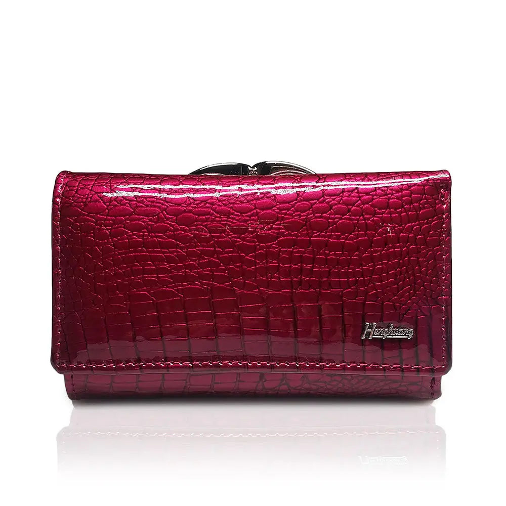 A glossy magenta retro crocodile pattern leather trifold wallet with silver-toned clasp and crocodile skin texture.