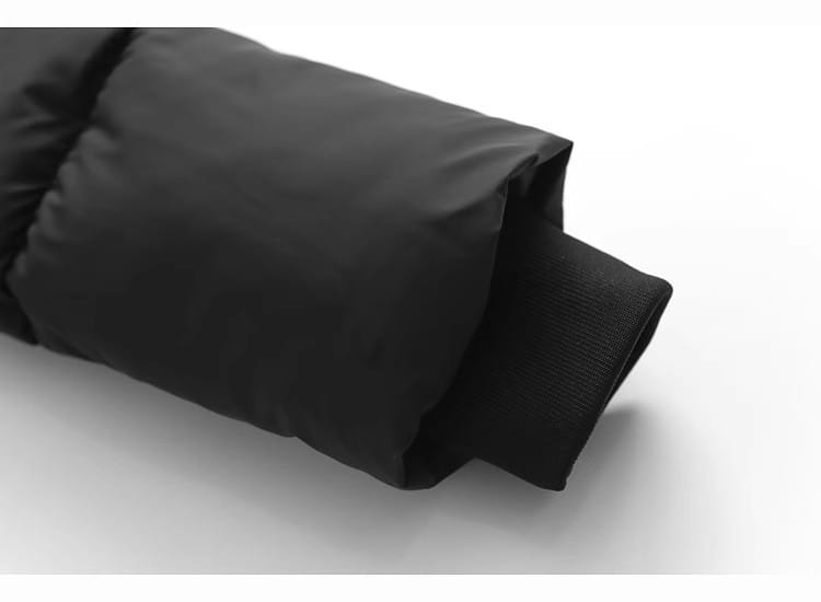 black hooded puffer cotton coat sleeve with quilted stitching and ribbed cuff for cold weather wear