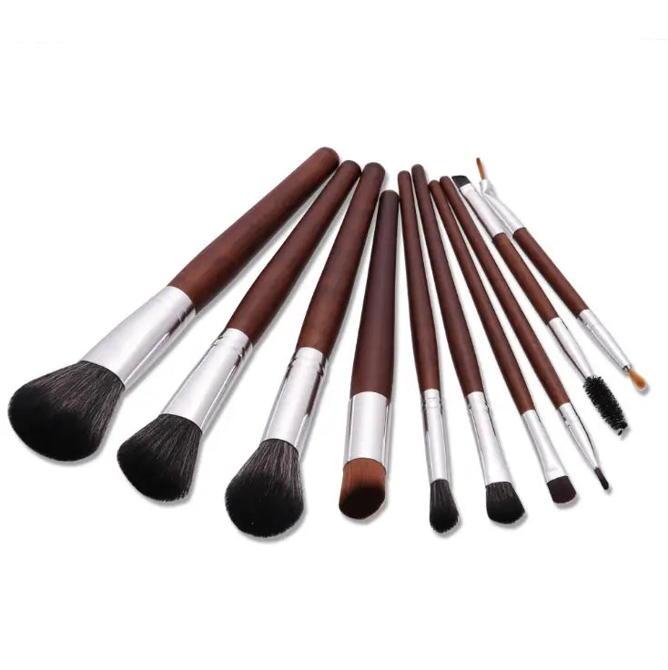 Set of ten professional makeup brushes with dark brown wooden handles, silver metal ferrules, and black synthetic bristles for various cosmetic applications.