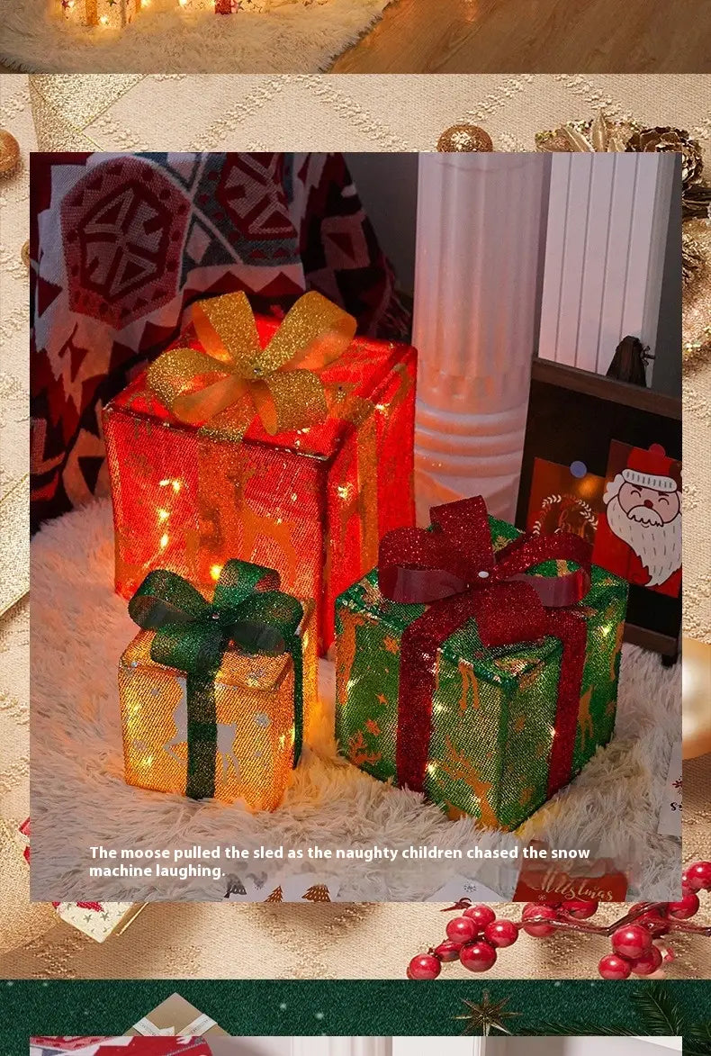 three illuminated led christmas gift boxes with glittery red and green bows for holiday decoration