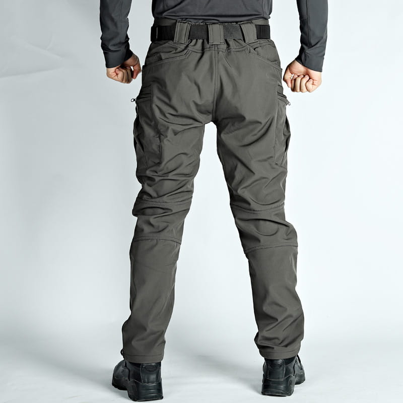 Men’s fleece-lined waterproof tactical pants in dark gray featuring multiple cargo pockets and a reinforced belt loop system.
