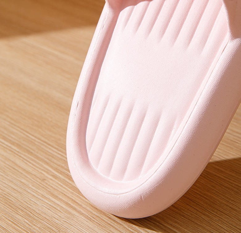 Pink rubber quilted non slip lightweight home slide sandal with ribbed texture and smooth rounded edges.