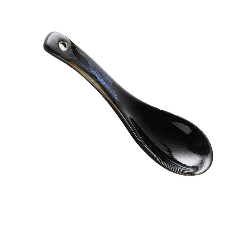 A sleek black ceramic spoon with a glossy finish and subtle iridescent blue highlights is shown with the ramen bowl ceramic 8.5 inch cat eye blue noodle bowl.