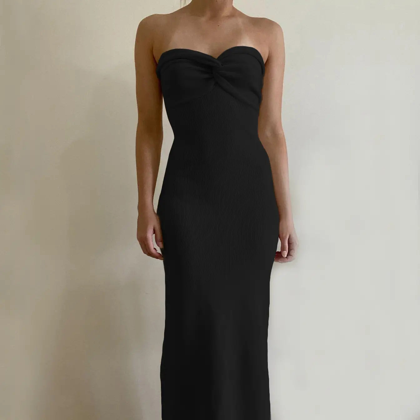 black ribbed strapless gown with a sweetheart neckline and fitted silhouette made of knit fabric suitable for formal occasions