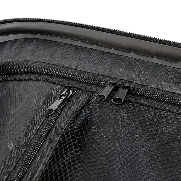 black mesh-lined zipper compartment inside the 3-in-1 pink hard shell large capacity suitcase set bag made of black fabric