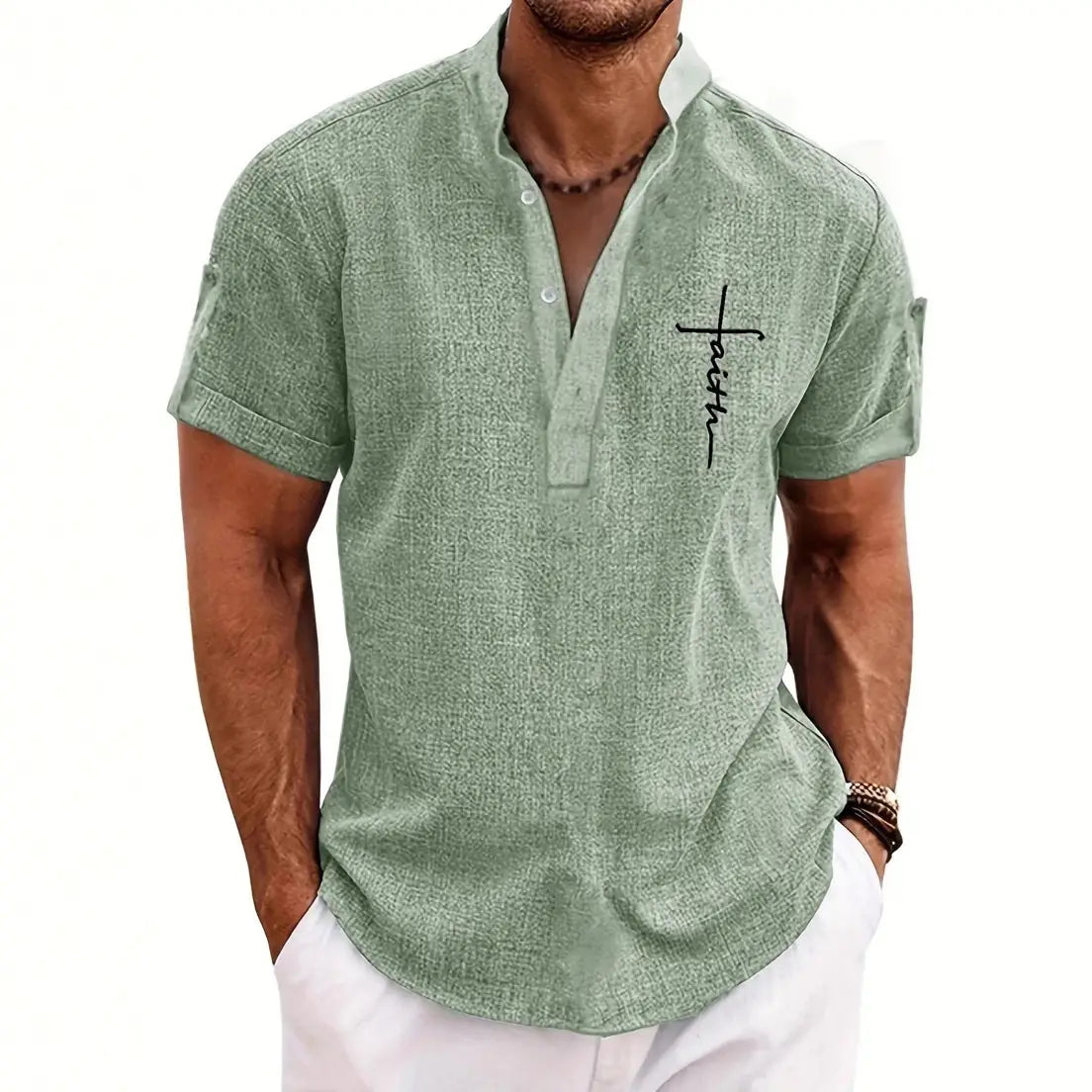 A light green textured short sleeve henley shirt for men featuring black cross and word embroidery on the chest.