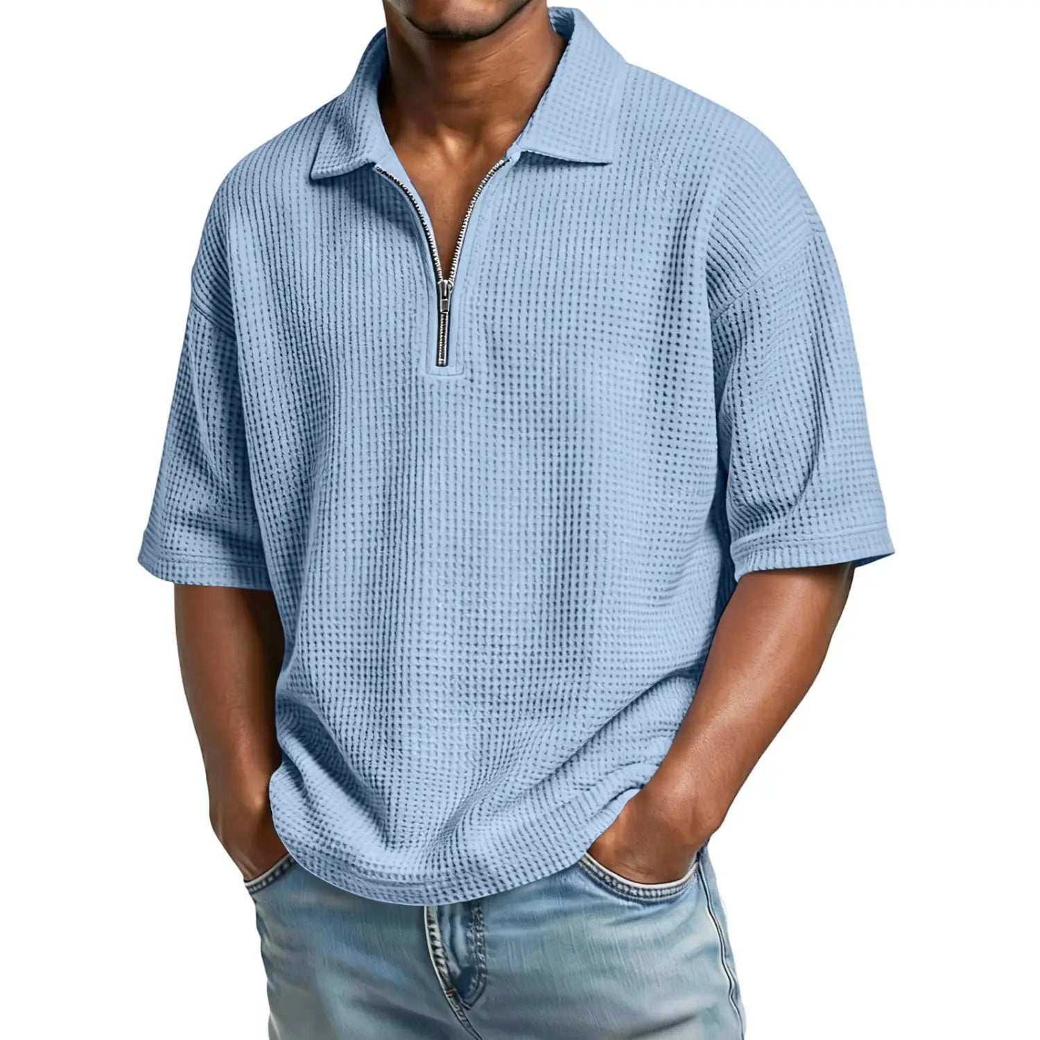 Light blue men’s waffle knit half zip short sleeve polo shirt with textured fabric and a zipper front.